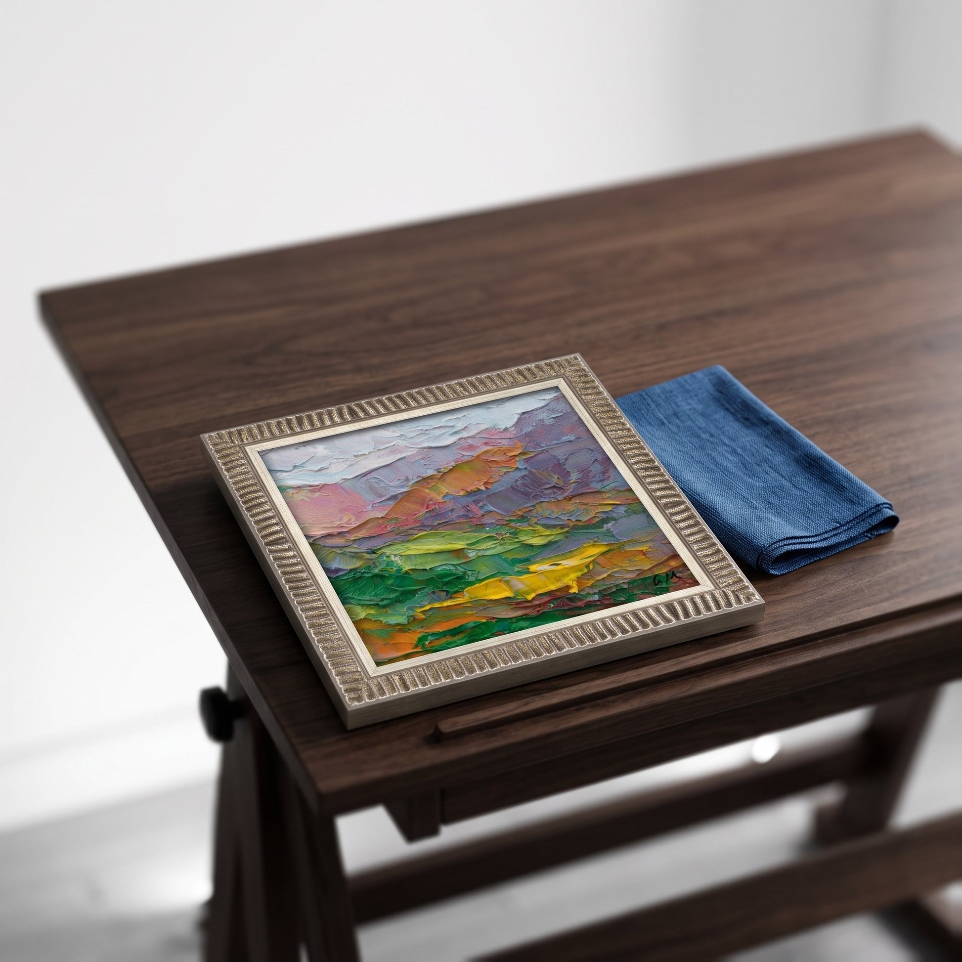 Contemporary study — Original Expressionist landscape painting adds vibrant color and emotional depth to minimalist workspace