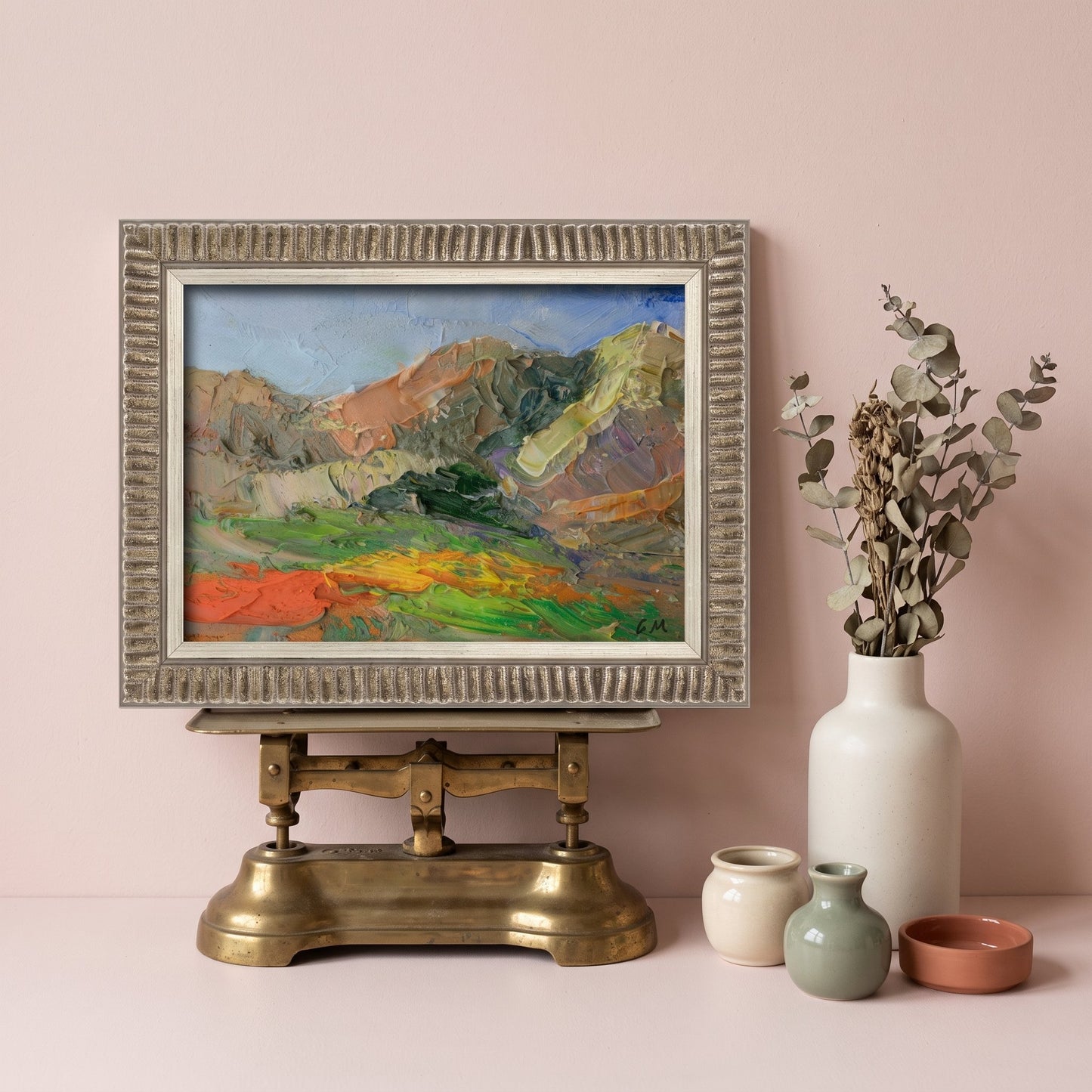 Minimalist living room — expressive landscape painting adds vibrant color and emotional depth to serene space