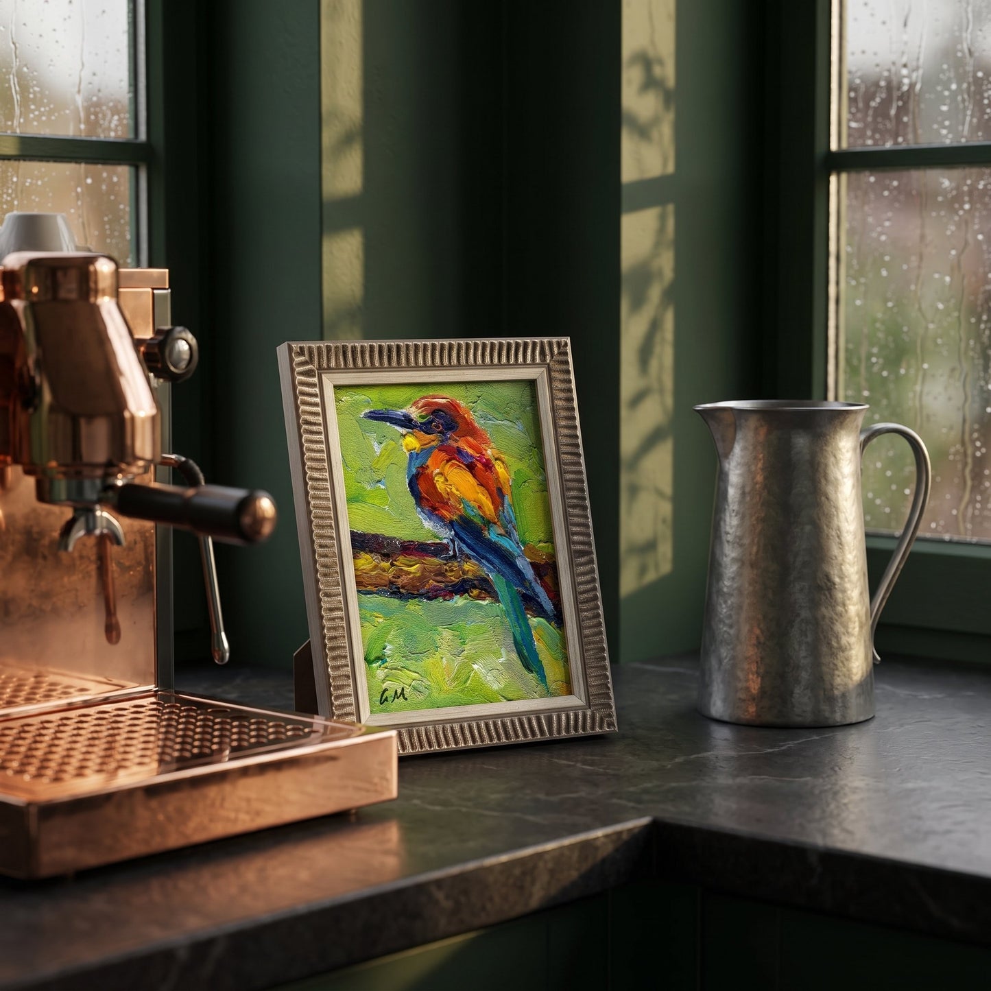 A vividly painted kingfisher perches on a branch in a small framed canvas, glowing beside a copper espresso machine on a rainy-day kitchen counter.