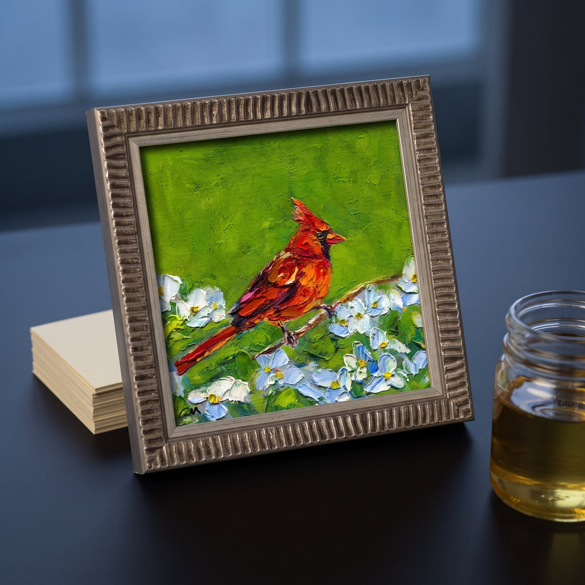 Modern minimalist living room — vibrant Impressionist bird painting adds color and life to sleek, neutral space