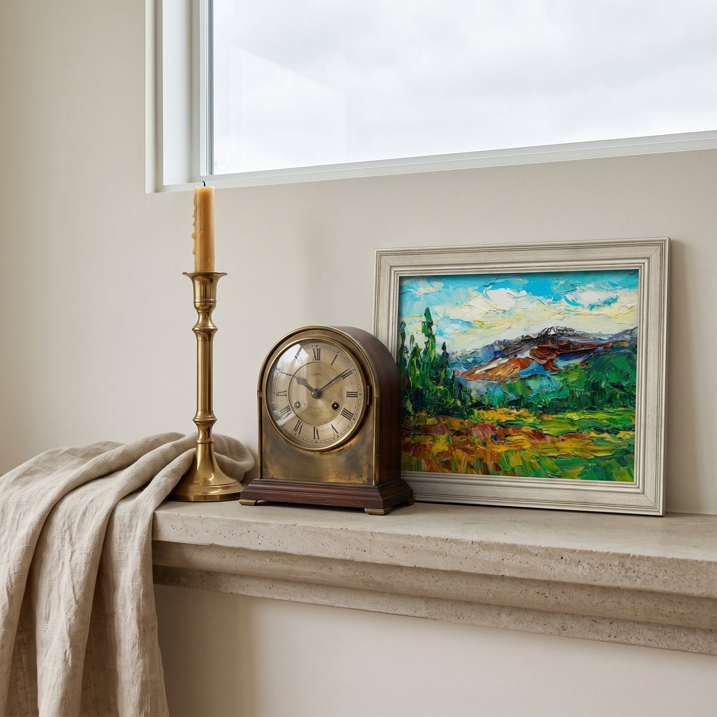 Minimalist living room — vibrant Impressionist landscape adds color and soul to neutral space
