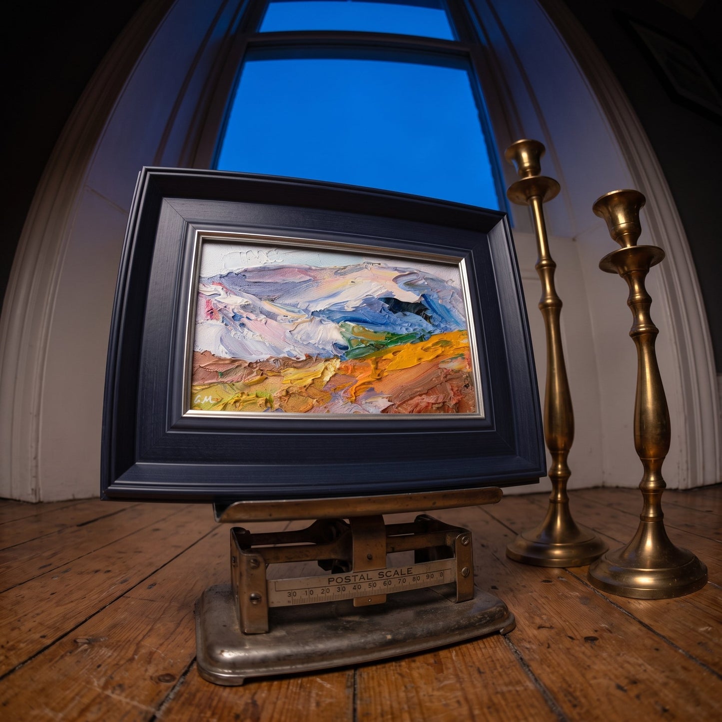 Rustic farmhouse entryway — Expressive landscape painting adds vibrant color and texture to warm wooden space