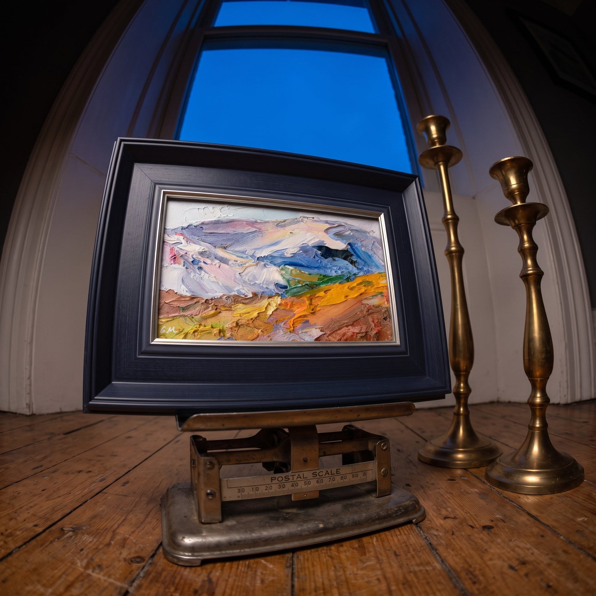 Rustic farmhouse entryway — Expressive landscape painting adds vibrant color and texture to warm wooden space