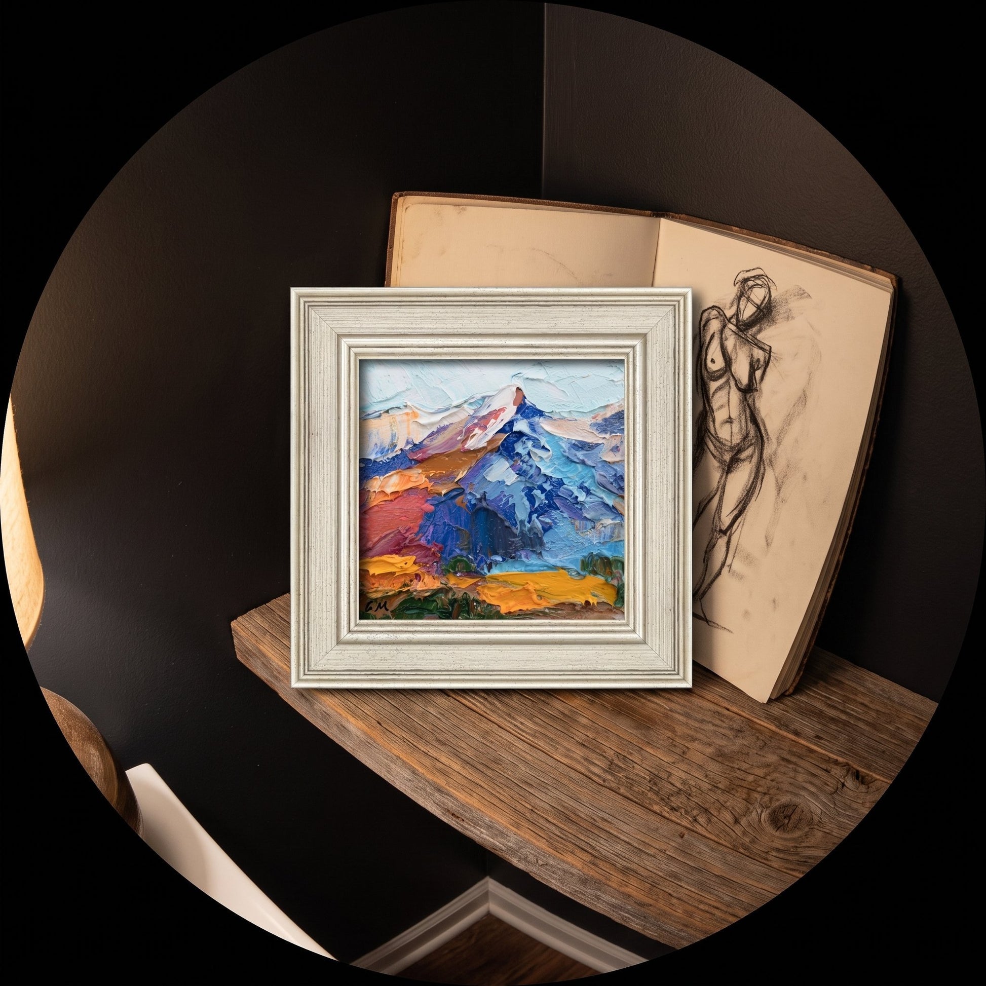 Contemporary study — Expressive landscape painting adds vibrant color and artistic energy to a minimalist space