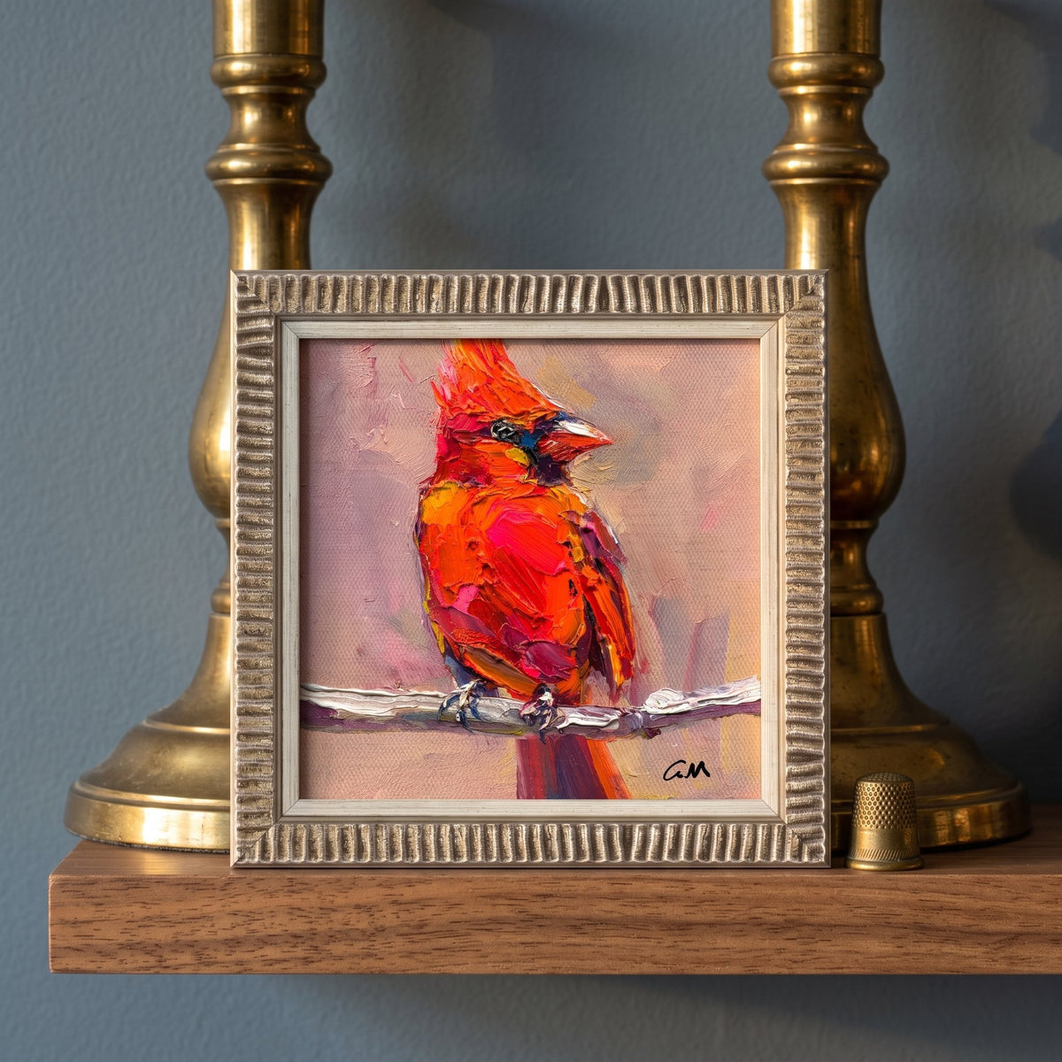 Contemporary entryway — vibrant cardinal painting adds warmth and artistic flair to the space