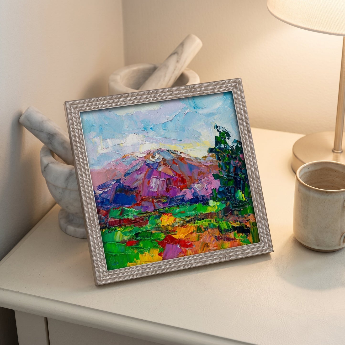 Minimalist bedroom — Vibrant expressionist landscape painting adds color and energy to a serene space