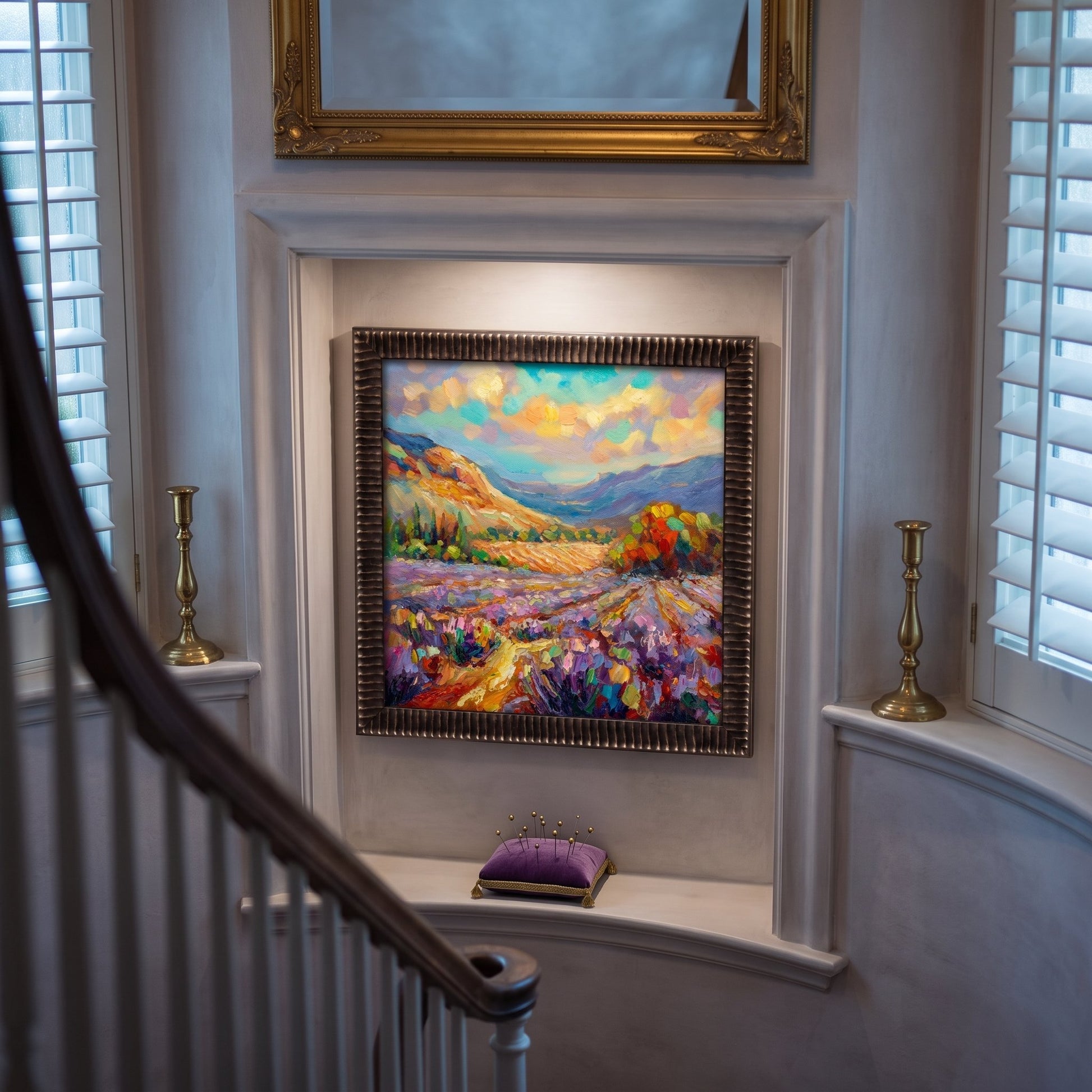 Traditional entryway — vibrant Impressionist landscape adds color and warmth to elegant interior
