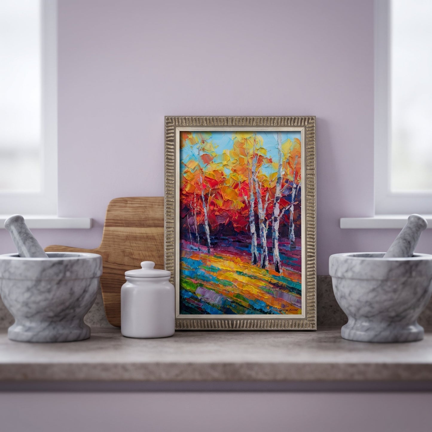 Contemporary kitchen — Vibrant expressionist landscape painting adds color and energy to minimalist space