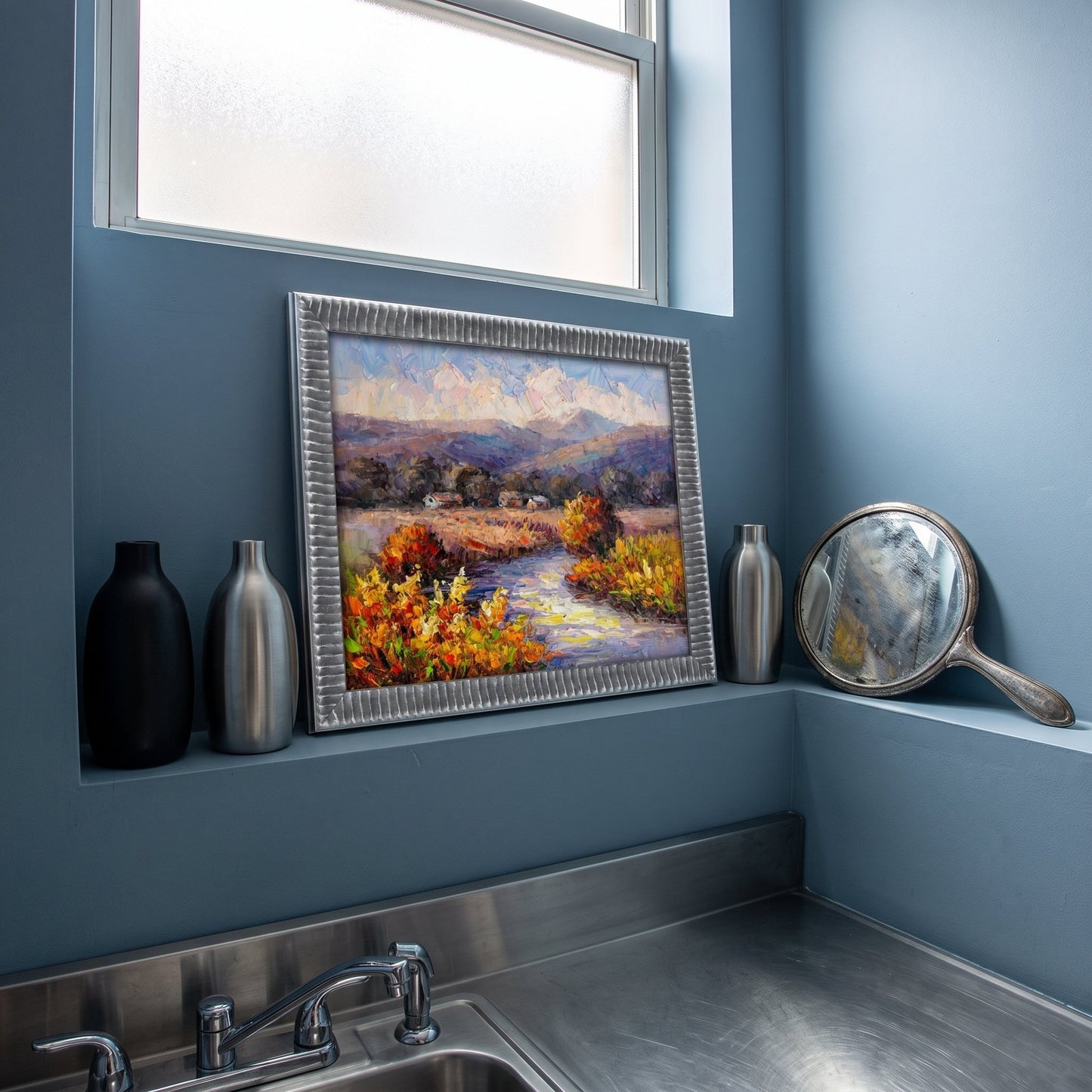 Modern minimalist bathroom — Impressionist landscape painting adds warmth and natural beauty to a serene, cool-toned space