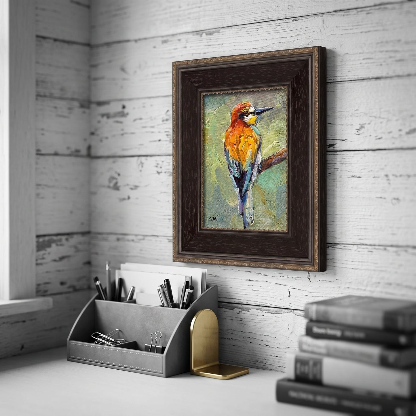 Rustic farmhouse study — vibrant bird painting adds color and life to a tranquil workspace