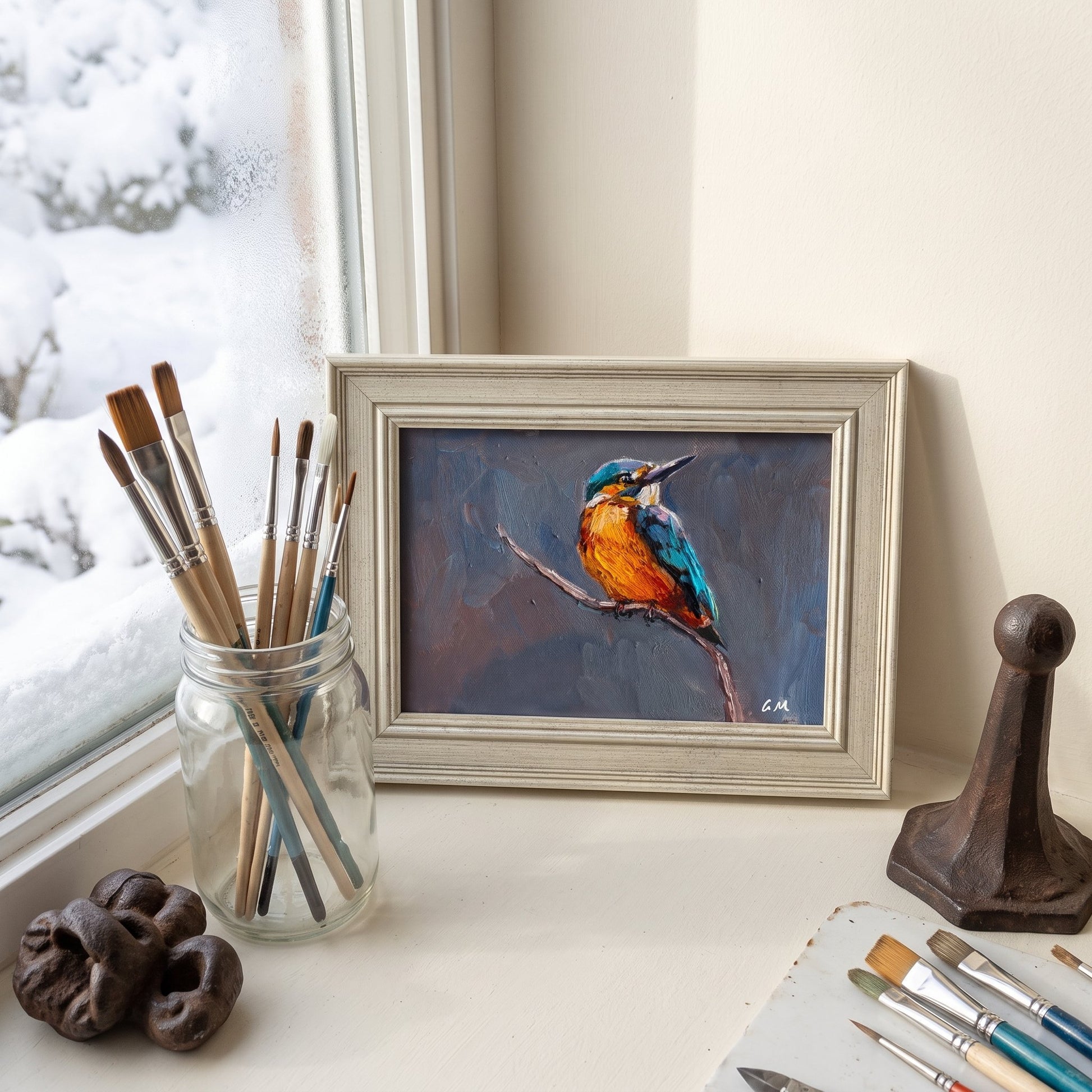 Artist's studio, minimalist contemporary — vibrant kingfisher painting adds color and life to a serene creative space