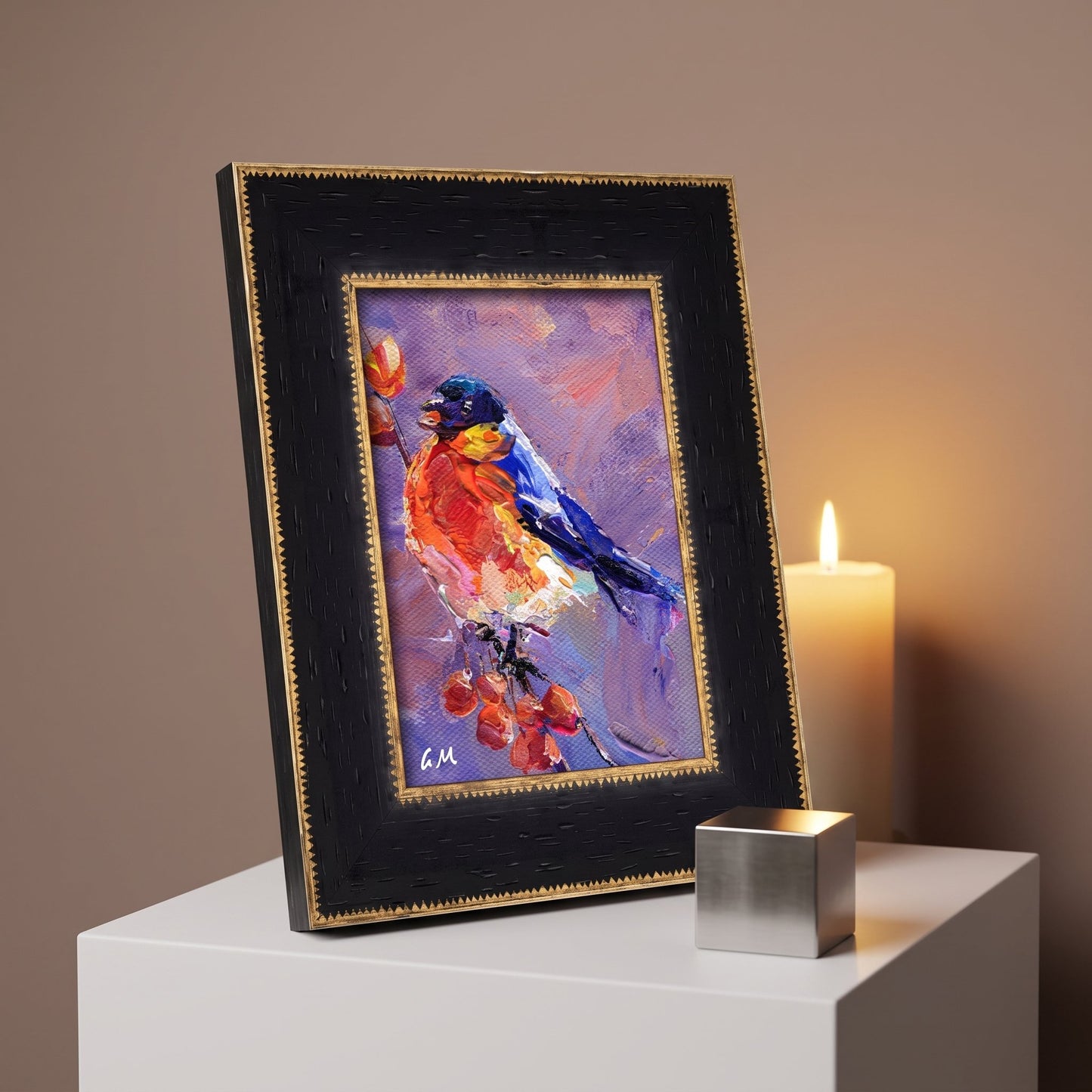 A vividly painted bird with fiery red and deep blue plumage perches on berries in an expressive oil painting, displayed in a black and gold frame on a white pedestal beside a glowing candle.