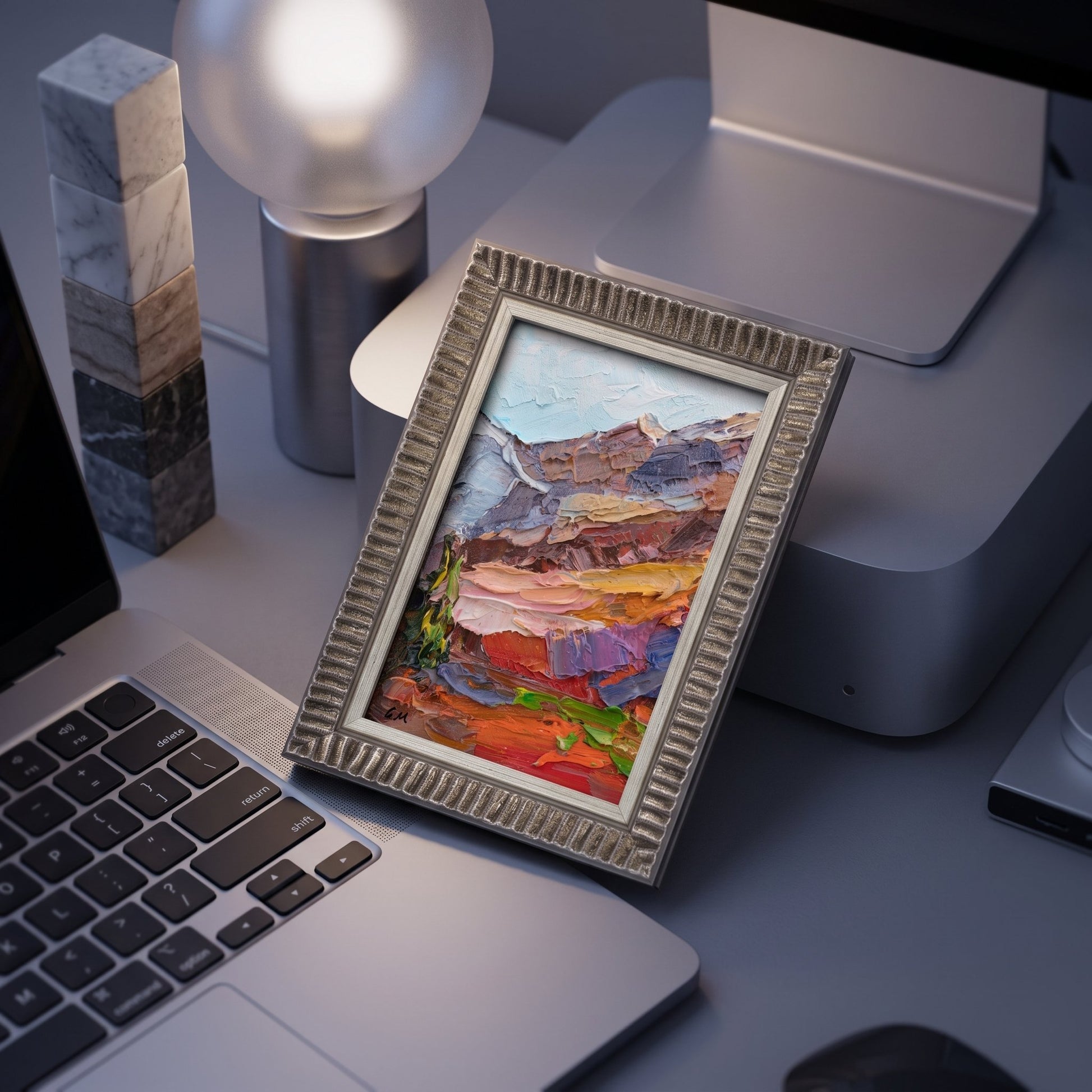 Contemporary home office — vibrant expressionist landscape painting adds warmth and artistic energy to minimalist workspace