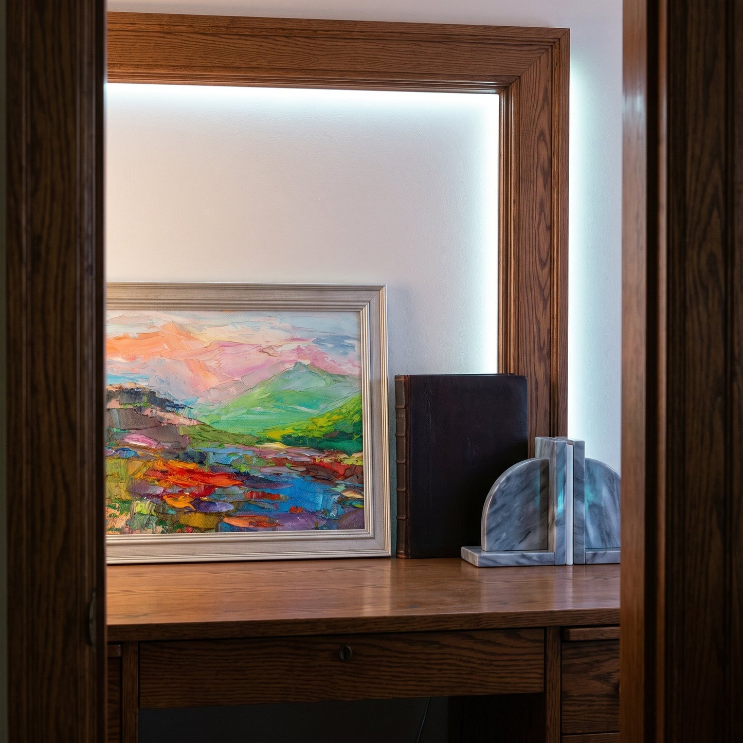 Mid-century modern study — vibrant landscape painting adds color and artistic depth to a minimalist workspace
