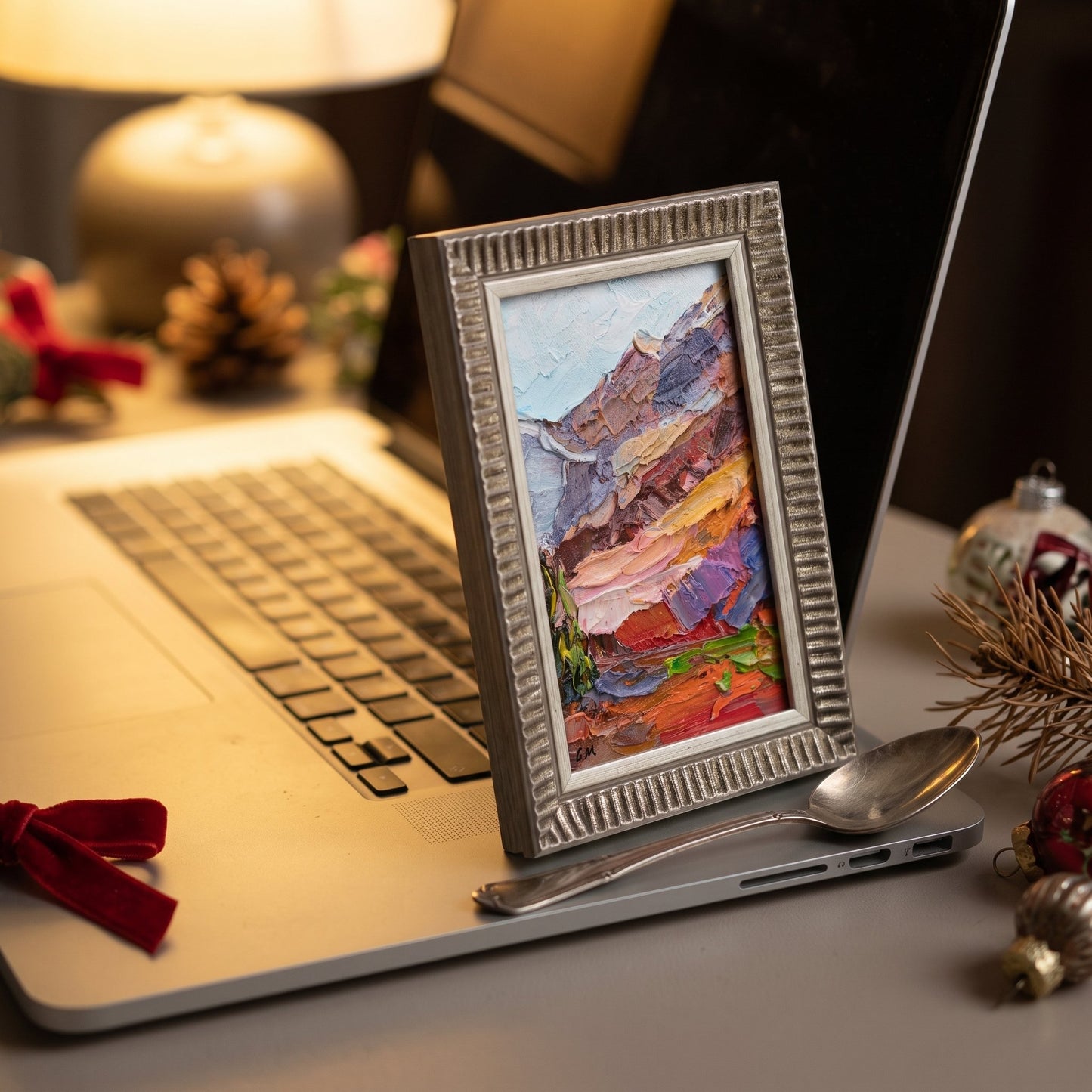 Contemporary rustic home office — vibrant expressionist landscape painting adds warmth and artistic energy to the workspace