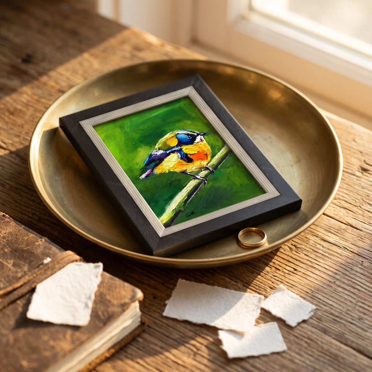 Rustic farmhouse study — Vibrant bird painting adds nature-inspired color and warmth to a sunlit reading nook
