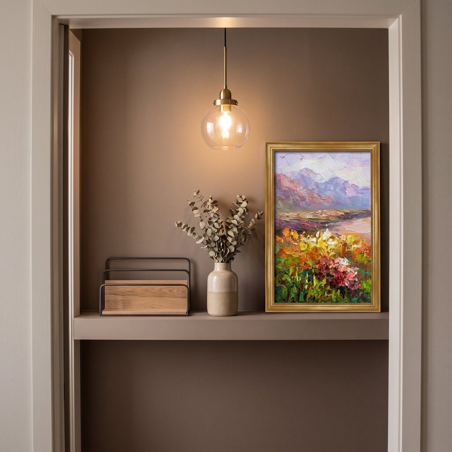 Minimalist entryway — vibrant Impressionist landscape painting adds warmth and color to a serene, modern space