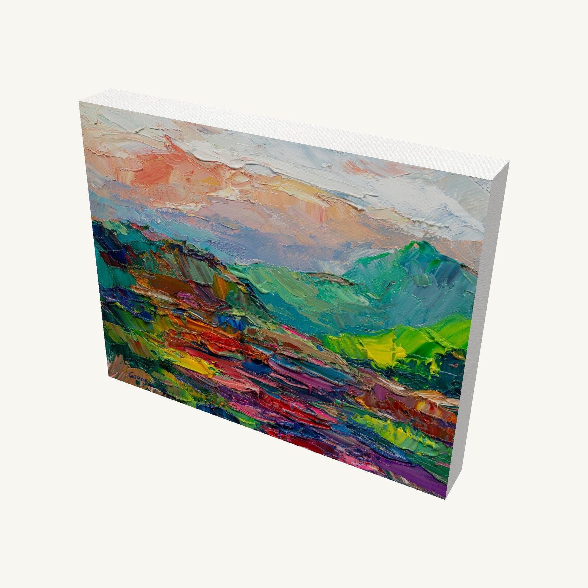 Vibrant expressionist mountain landscape painting on gallery-wrapped canvas, viewed at an angle, showcasing textured oil brushwork and colorful terrain with visible side edges and depth