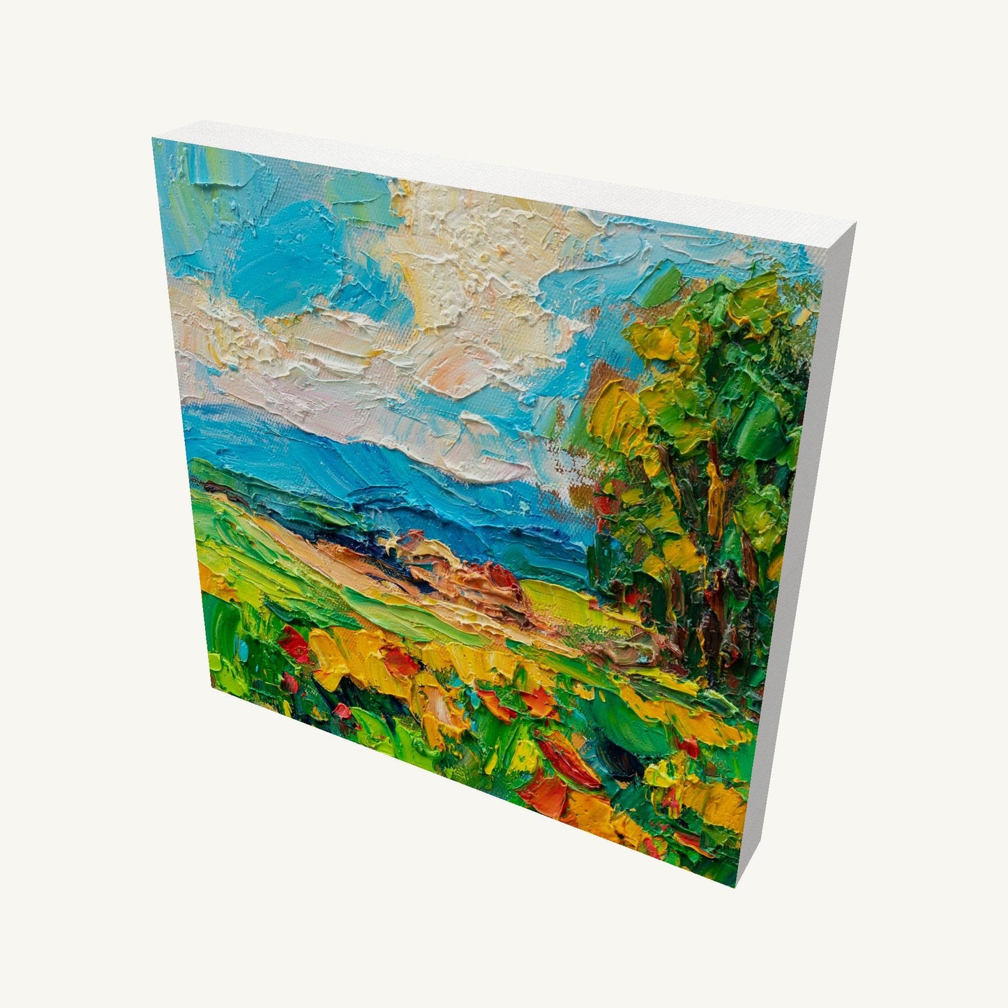 Luminous coastal field landscape painting on gallery-wrapped canvas, viewed at an angle, showcasing textured oil brushwork and vibrant blues, greens, and yellows