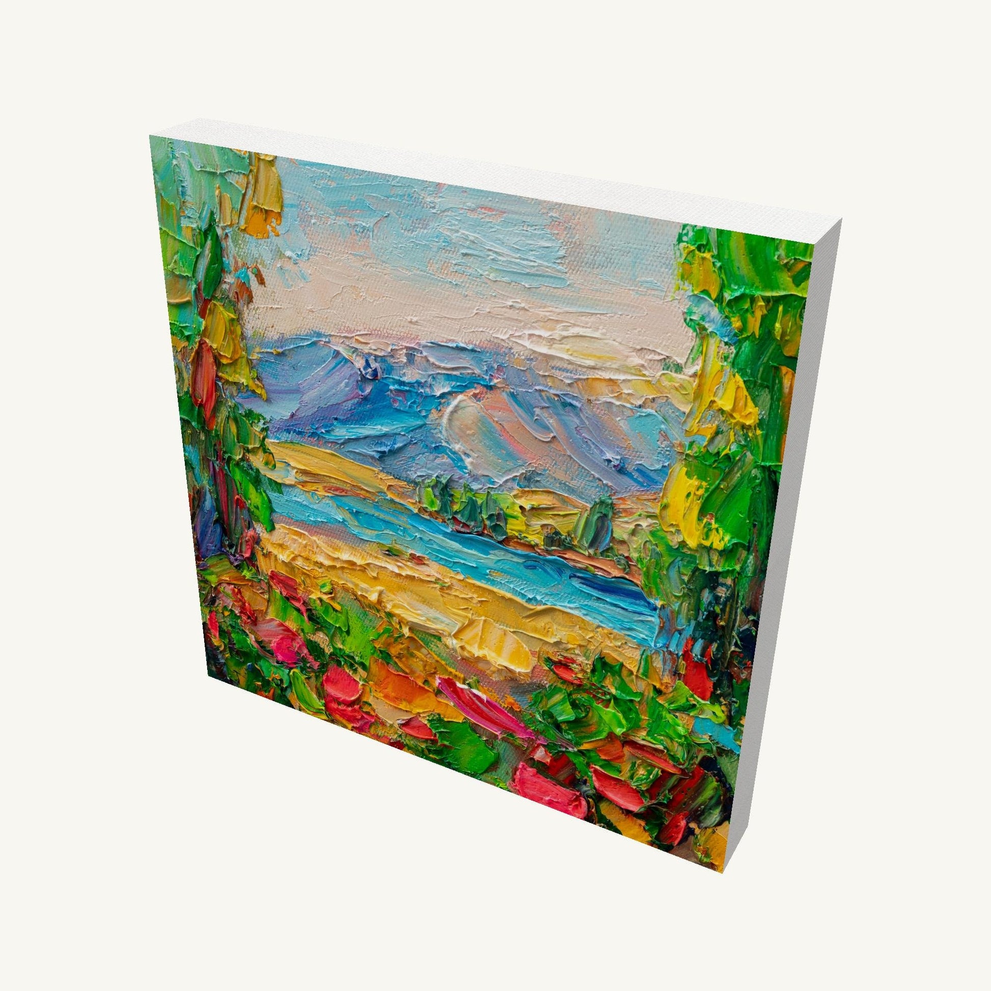 Hand-painted mountain lake scene on gallery-wrapped canvas, viewed at an angle, showcasing textured oil paint and vibrant colors with visible side edges and depth