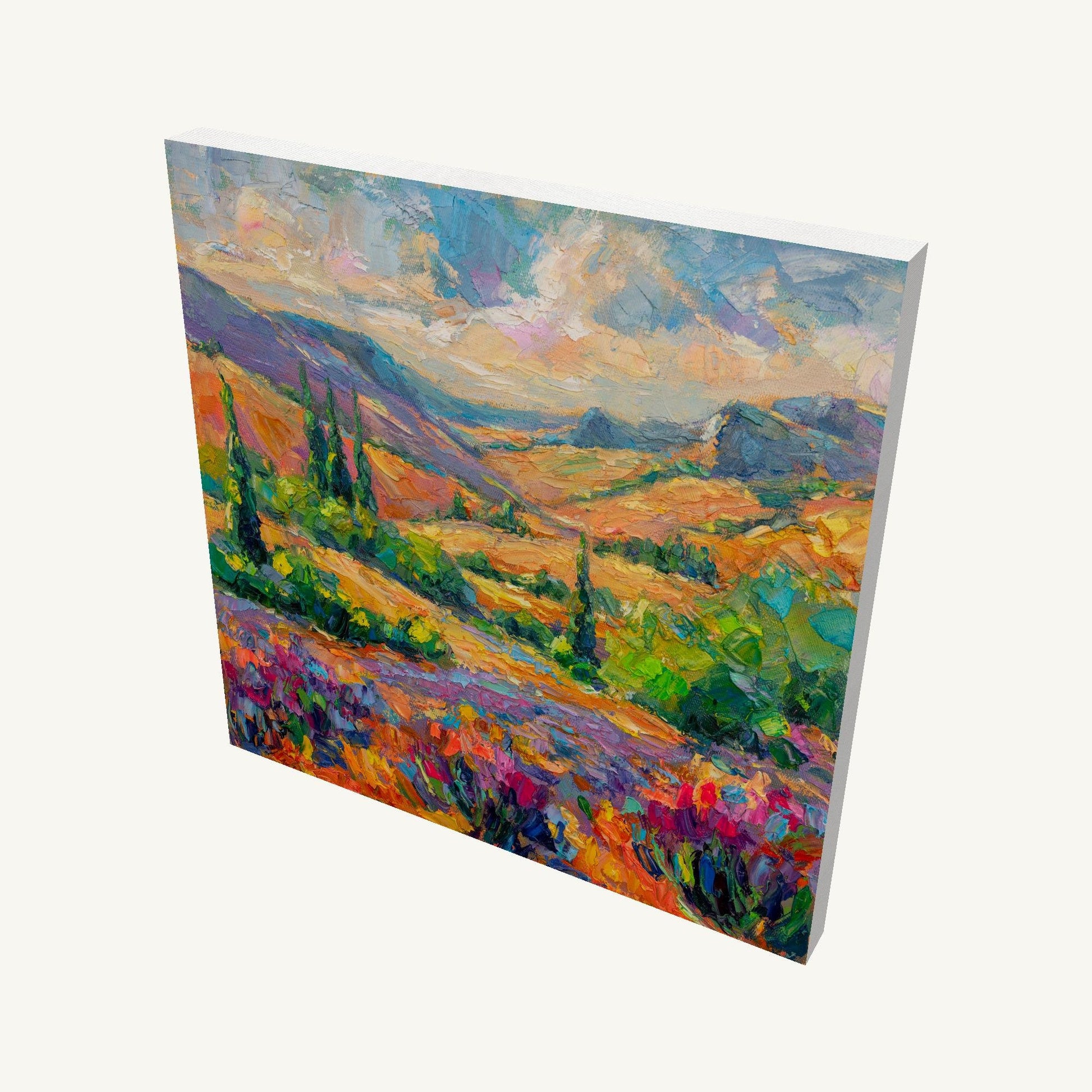 Gallery-wrapped canvas painting of a vibrant autumn meadow with rolling hills, colorful wildflowers, and distant mountains, viewed at an angle showing depth and side edges