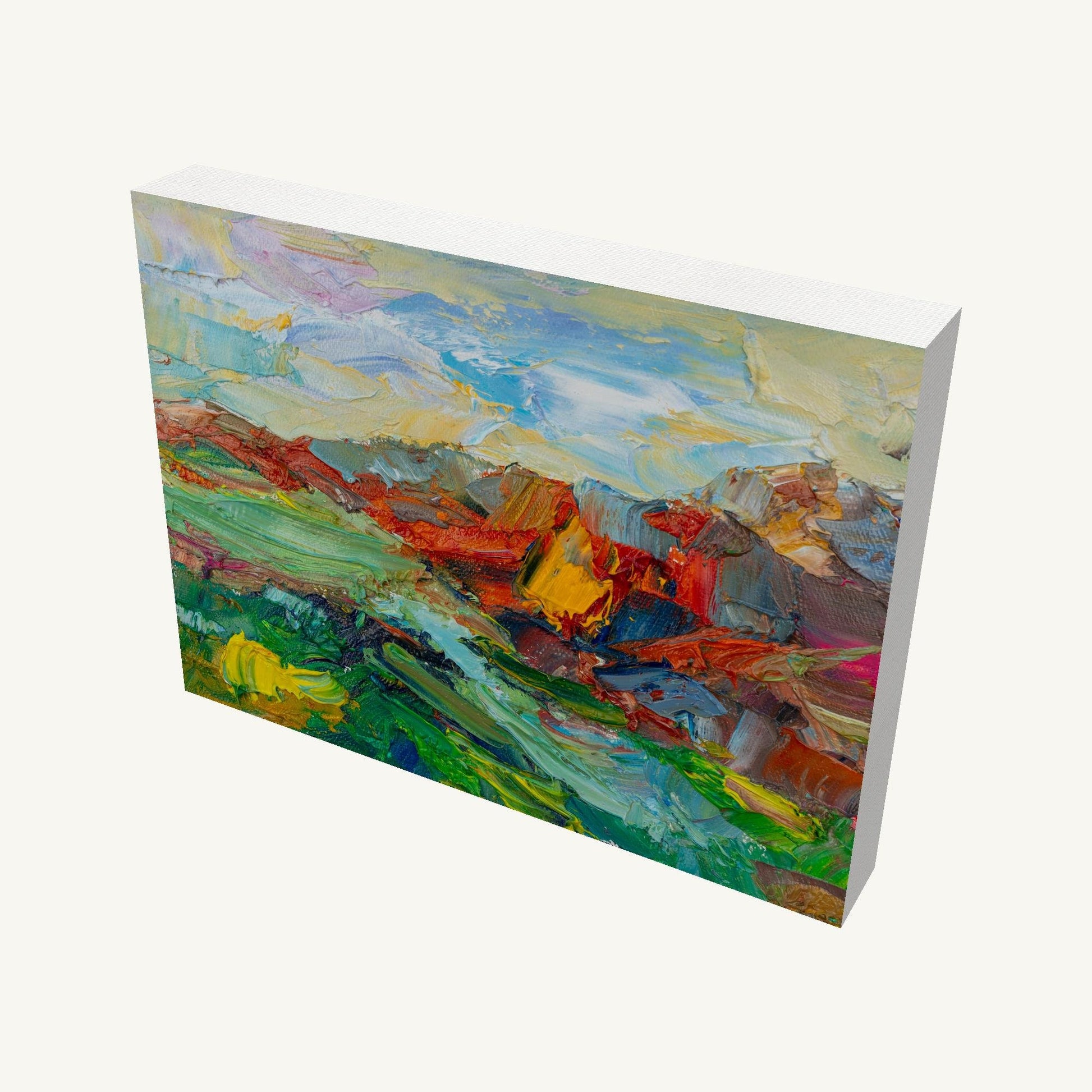 Expressive mountain landscape oil painting on gallery-wrapped canvas, viewed at an angle, showcasing vibrant colors and textured brushwork with visible depth and side edges
