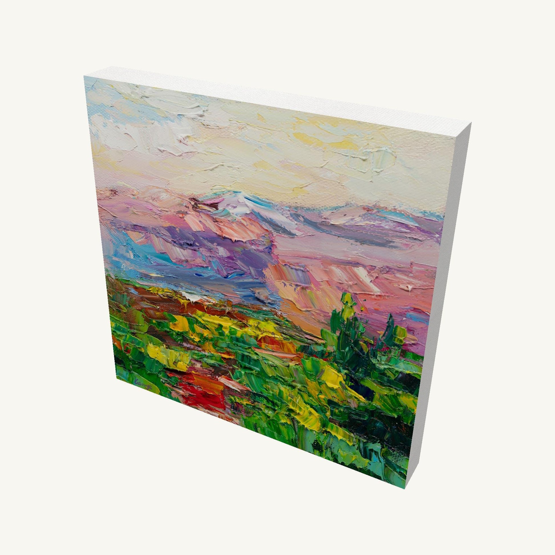 Desert sunset oil painting on gallery-wrapped canvas, angled view showing depth and painted edges, vibrant landscape with pink, blue, and green hues