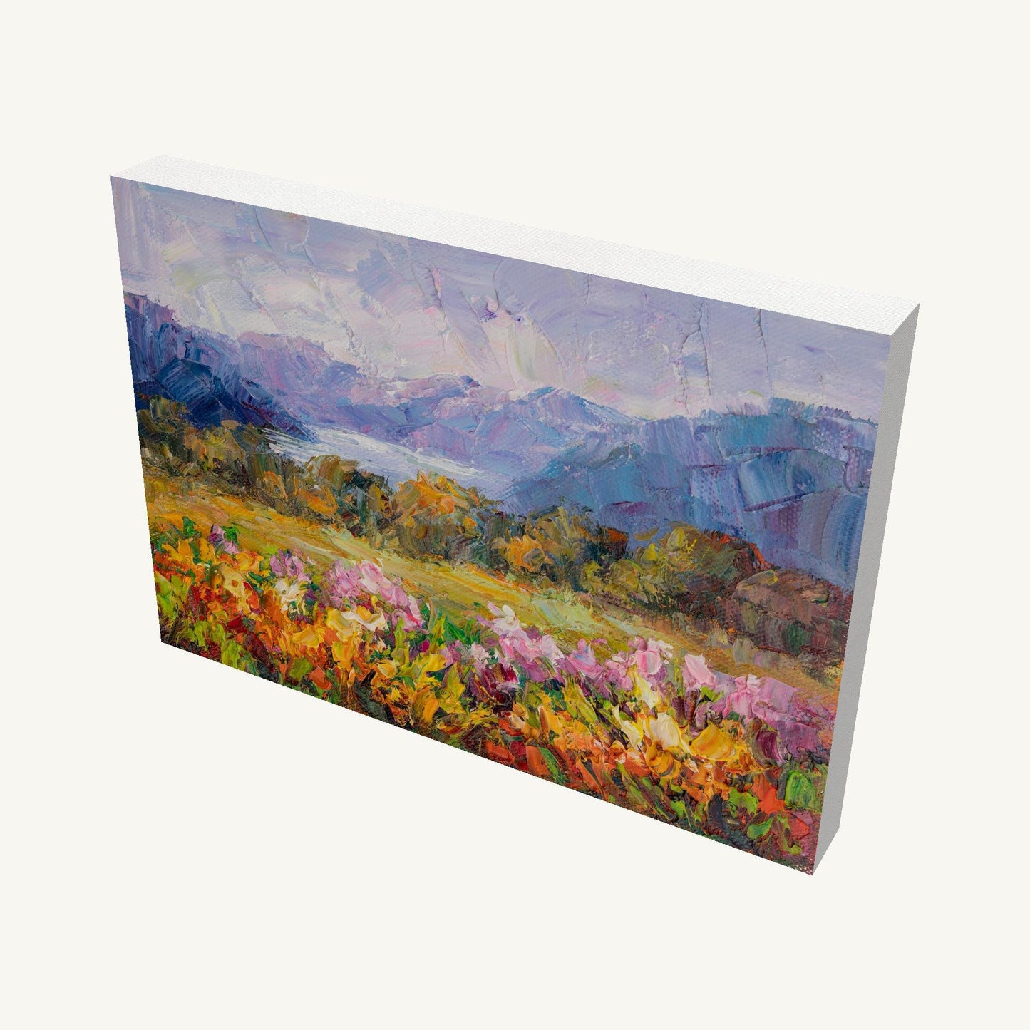 Hand-painted mountain meadow landscape on gallery-wrapped canvas, viewed at an angle, showcasing vibrant floral foreground and distant mountains, unframed and ready to hang