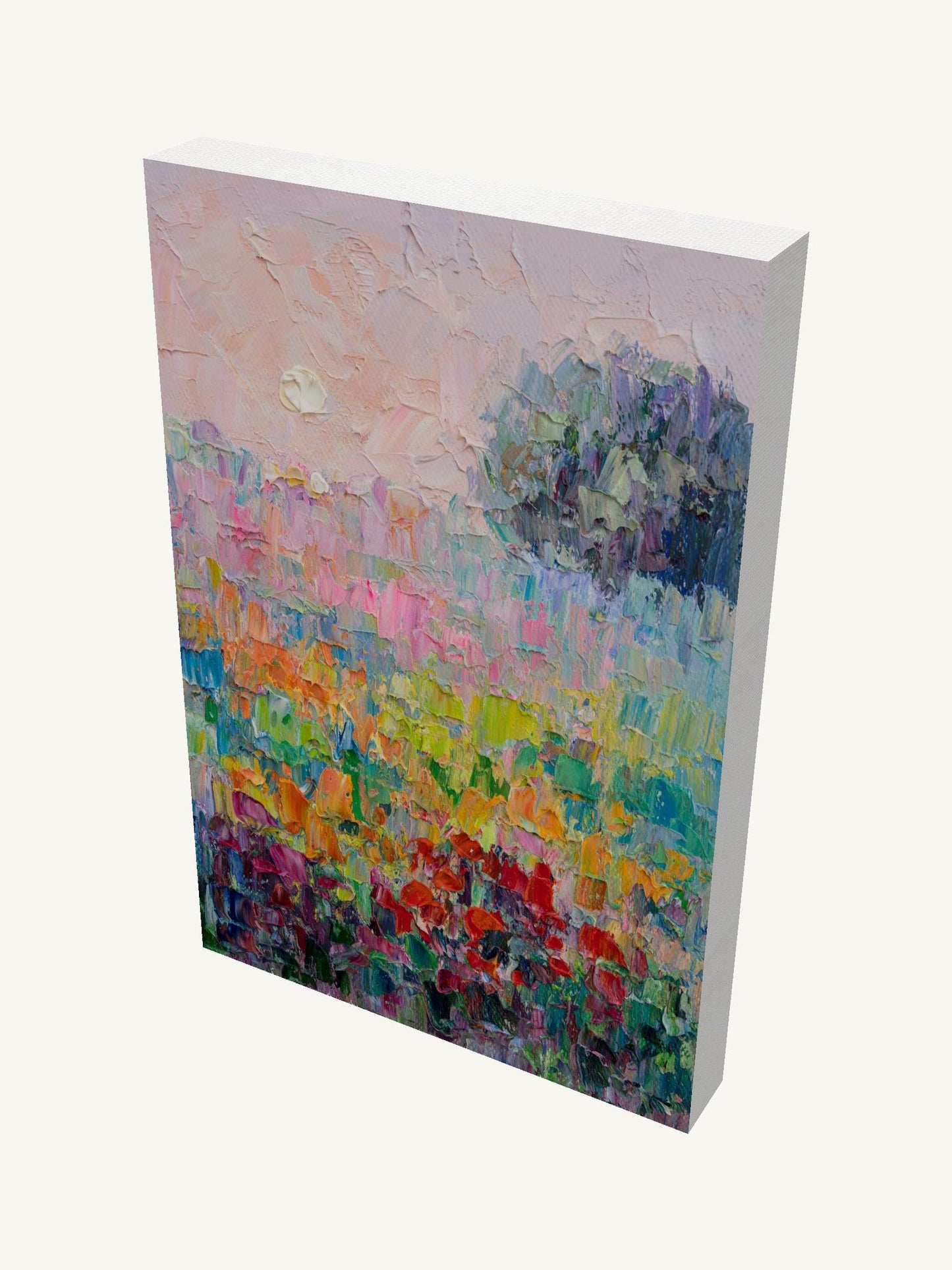 Vertical oil painting on gallery-wrapped canvas depicting a vibrant floral field with textured brushwork, viewed at an angle showing depth and side edges