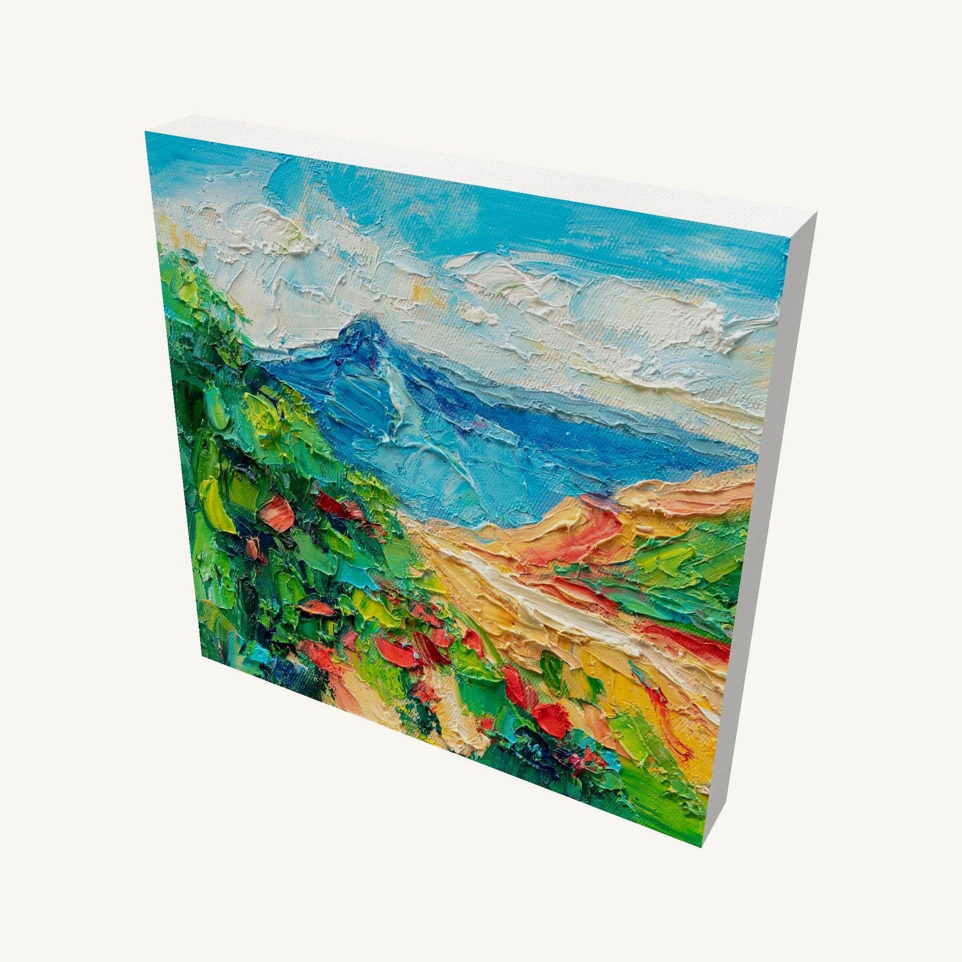 Abstract mountain landscape oil painting on gallery-wrapped canvas, viewed at an angle, showcasing textured brushwork and vibrant colors with visible depth and shadow