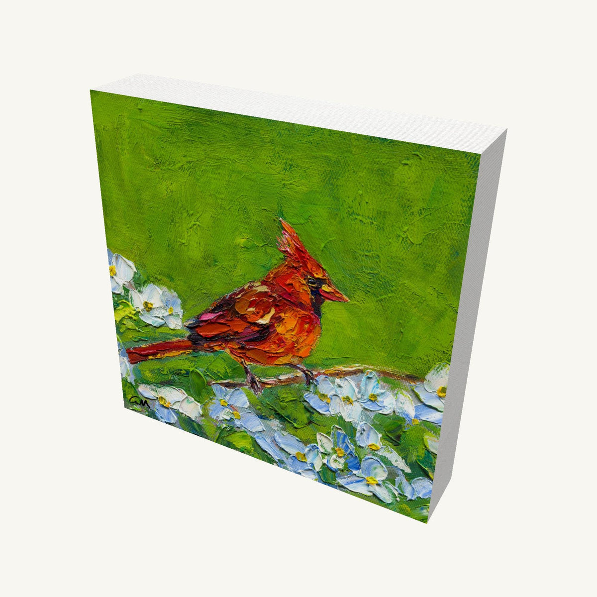 Gallery-wrapped canvas painting of a red cardinal perched on a branch with white flowers against a green background, viewed at an angle showing depth and side edges