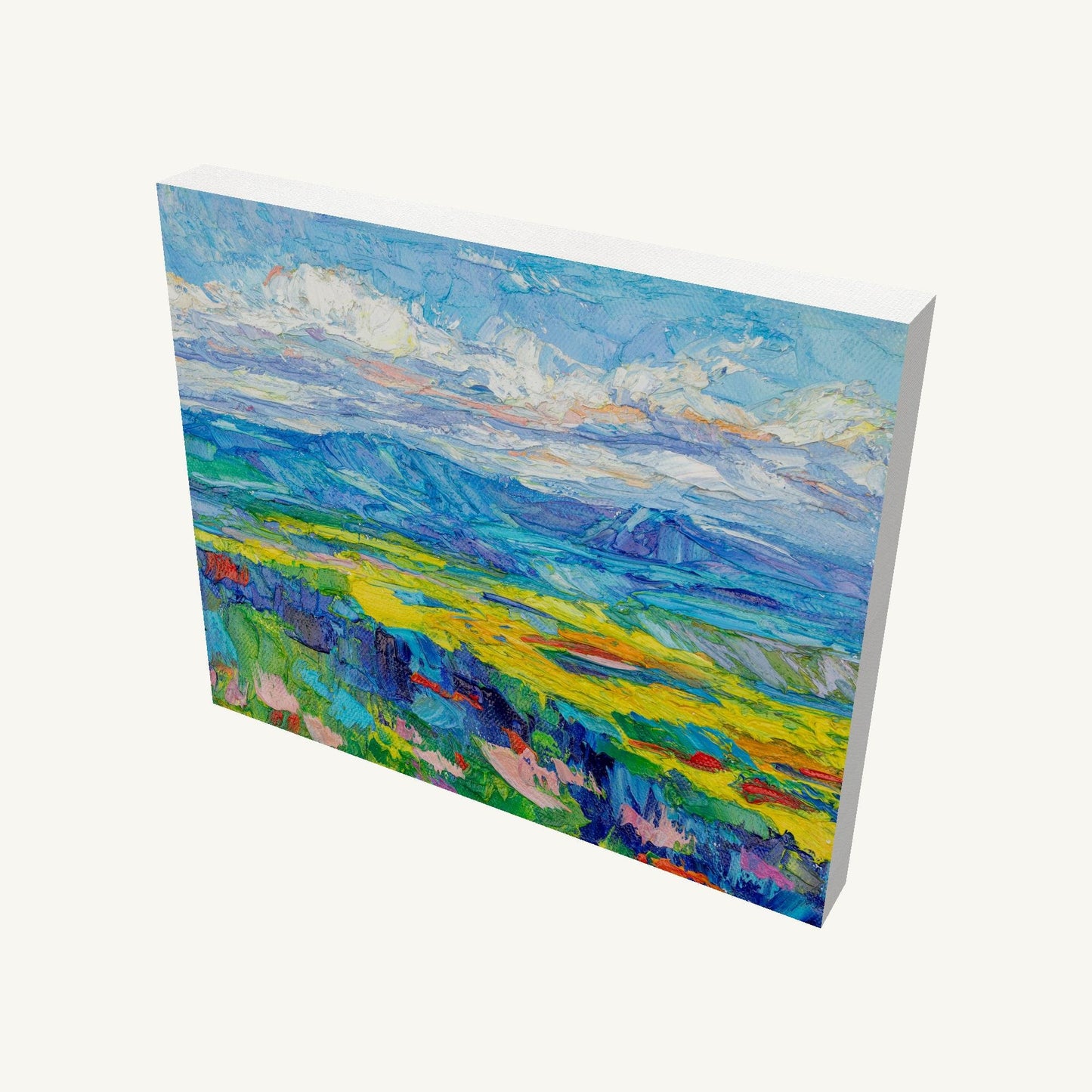 Gallery-wrapped canvas painting of a vibrant mountain meadow with thick impasto texture, viewed at an angle showing depth and side edges, unframed and ready to hang