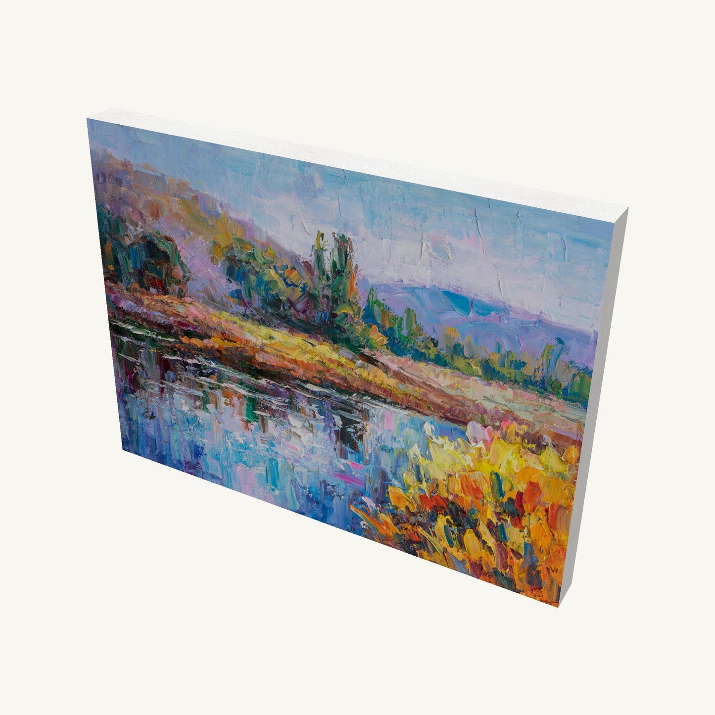 Gallery-wrapped canvas painting of a vibrant river landscape with impasto texture, viewed at an angle showing depth and side edges, unframed and ready to hang
