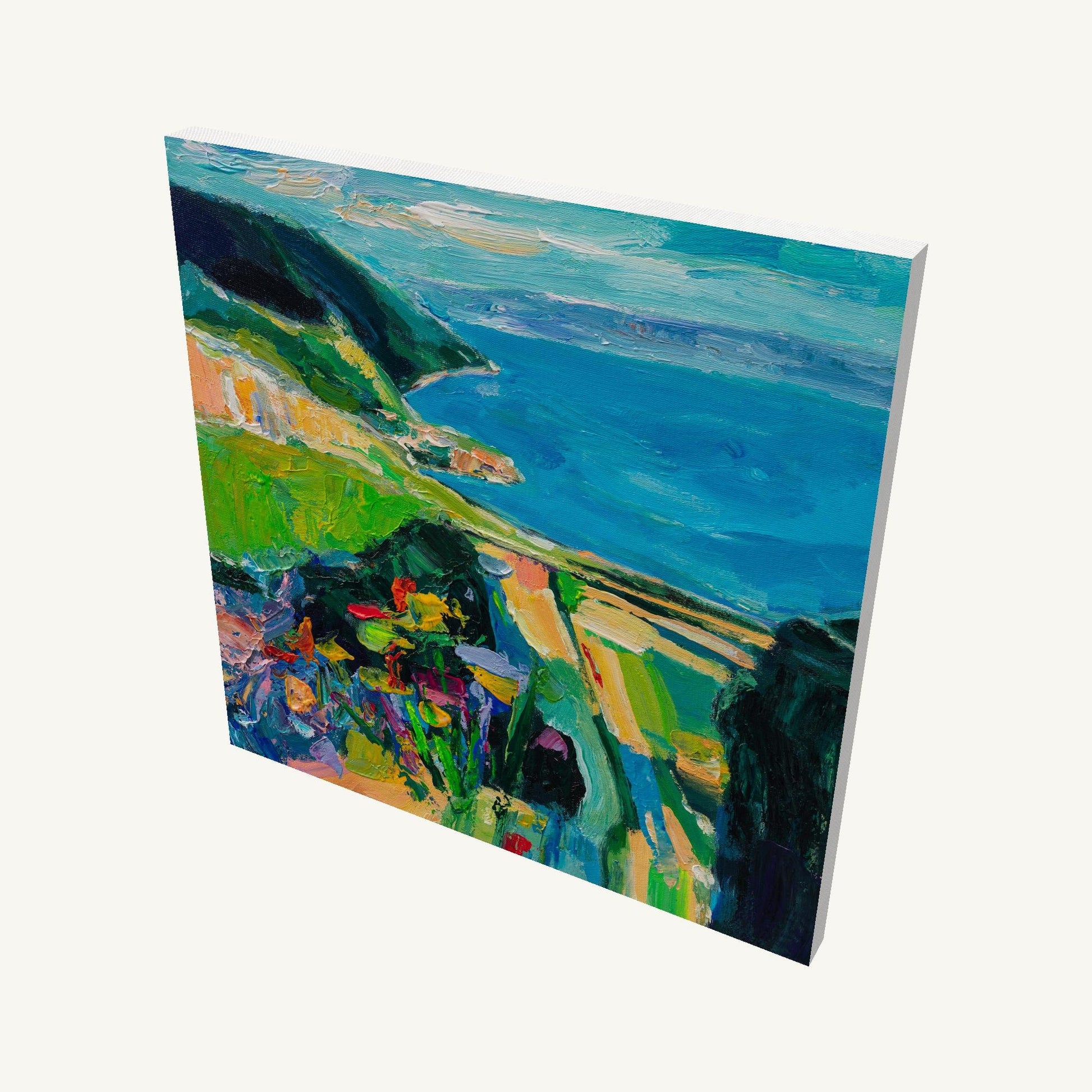 Impasto coastal landscape painting on gallery-wrapped canvas, angled view showing depth and textured brushwork with blue ocean, green hills, and vibrant foreground