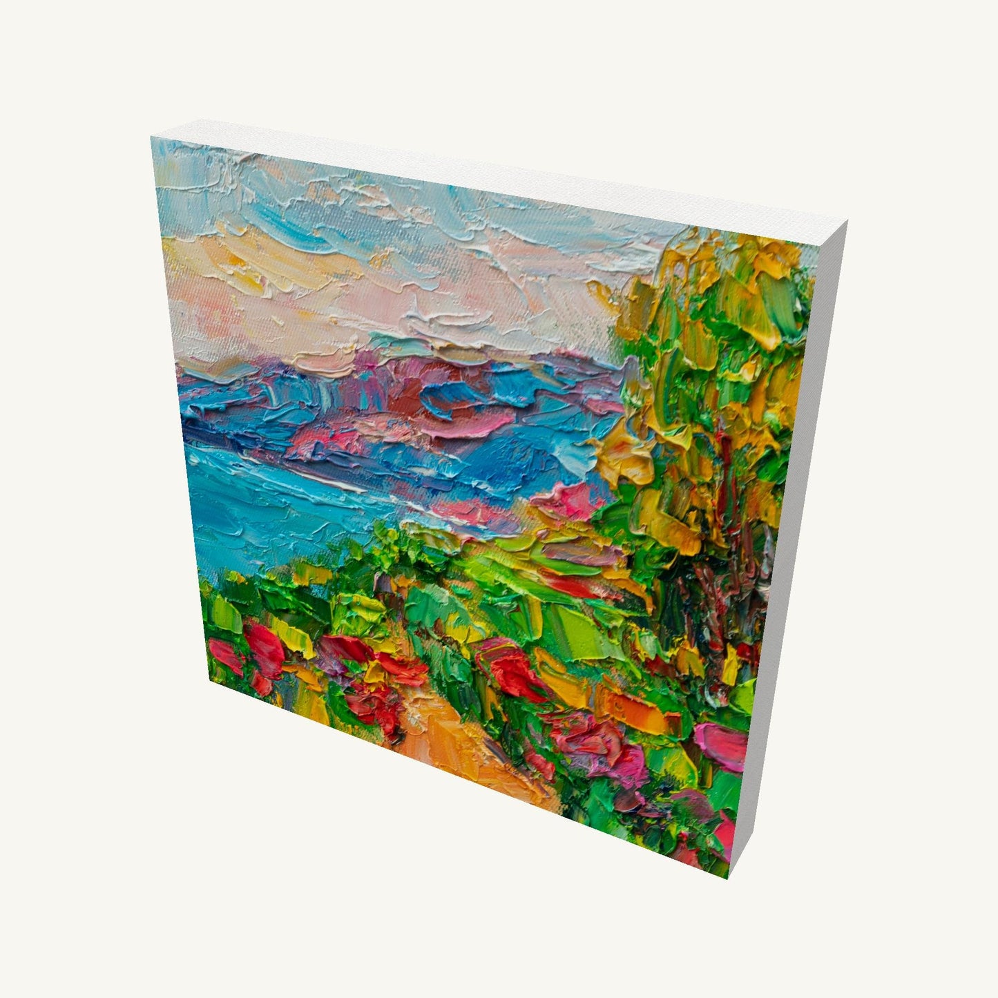 Vibrant coastal garden landscape painting on gallery-wrapped canvas, viewed at an angle, showcasing thick impasto texture and vivid colors with visible side edges and soft shadow