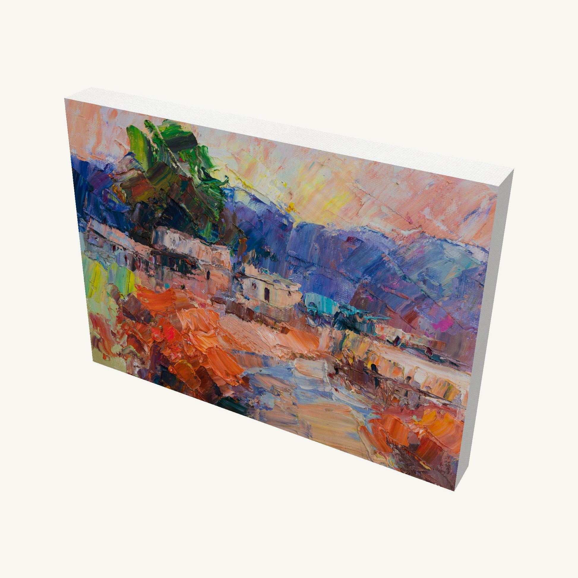 Gallery-wrapped canvas painting of a vibrant sunset village scene, viewed at an angle, showcasing textured oil brushwork and deep canvas edges with visible side wrapping